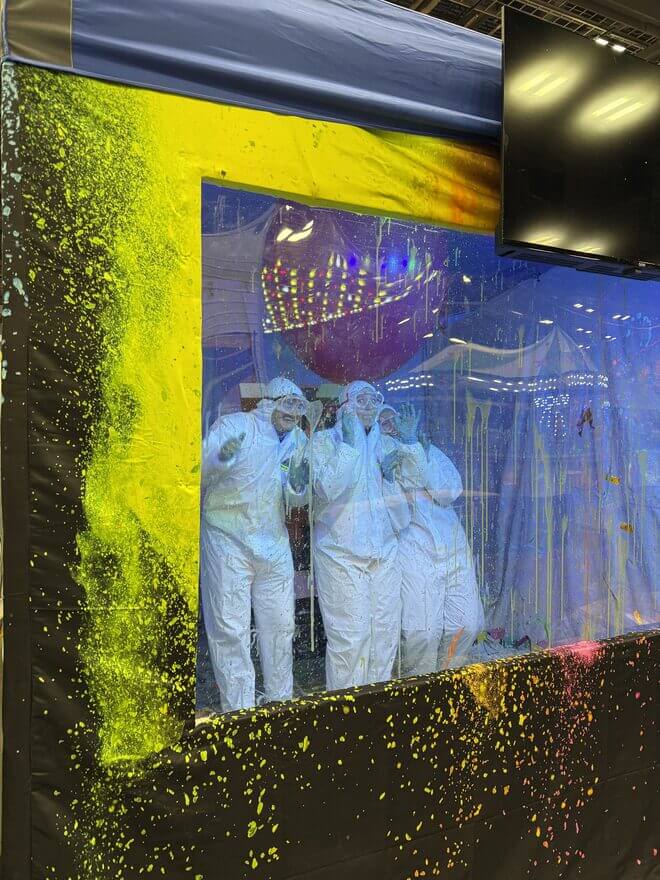 A squad in protective gear competing inside the Squad Game arena