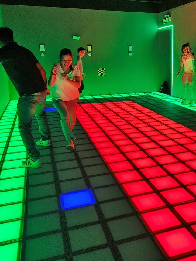 A team competing on the Super Grid interactive LED floor